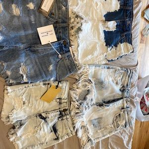 4 shorts, 3 brand new with tags. Size small and medium. Good condition